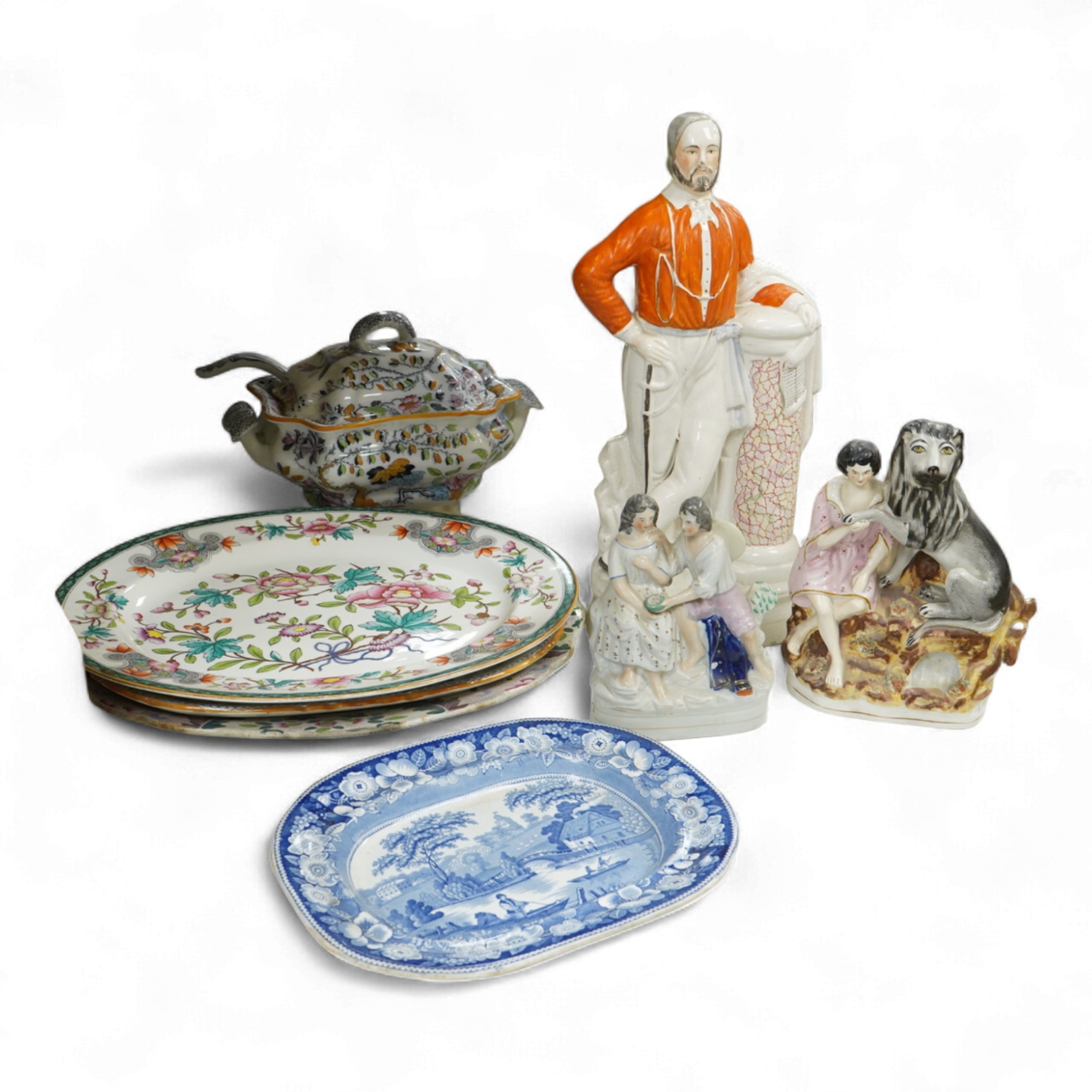 Three 19th century Staffordshire figures, including General Garibaldi, a Staffordshire pottery soup tureen and four serving plates, largest 48cm wide